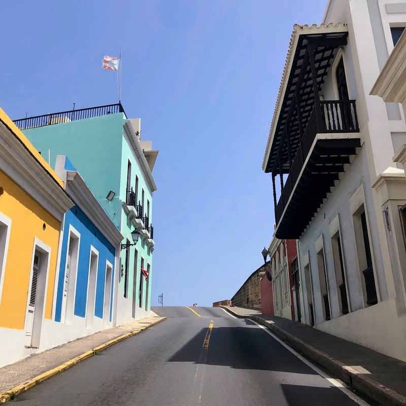 Colorful historic street in Old San Juan, Puerto Rico, featured in Root to Rise Retreat cultural immersion activities