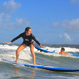 Surfing lesson on Puerto Rico’s coast during Root to Rise Retreat closing day