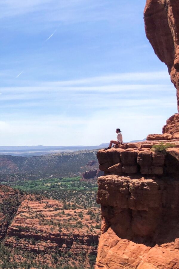 Sedona Cliff Teresa Prendes on top of a cliff in Sedona showing how move your mind llc helps mental performance