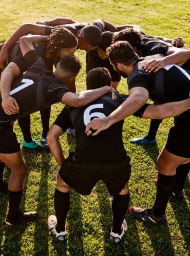 Team Huddles Group workshop in Puerto Rico building teamwork, focus, and resilience through performance psychology